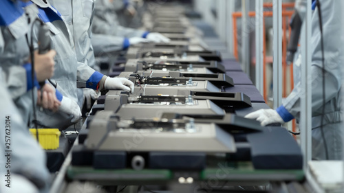 Line Assembly of TVs. Selective focus in the center