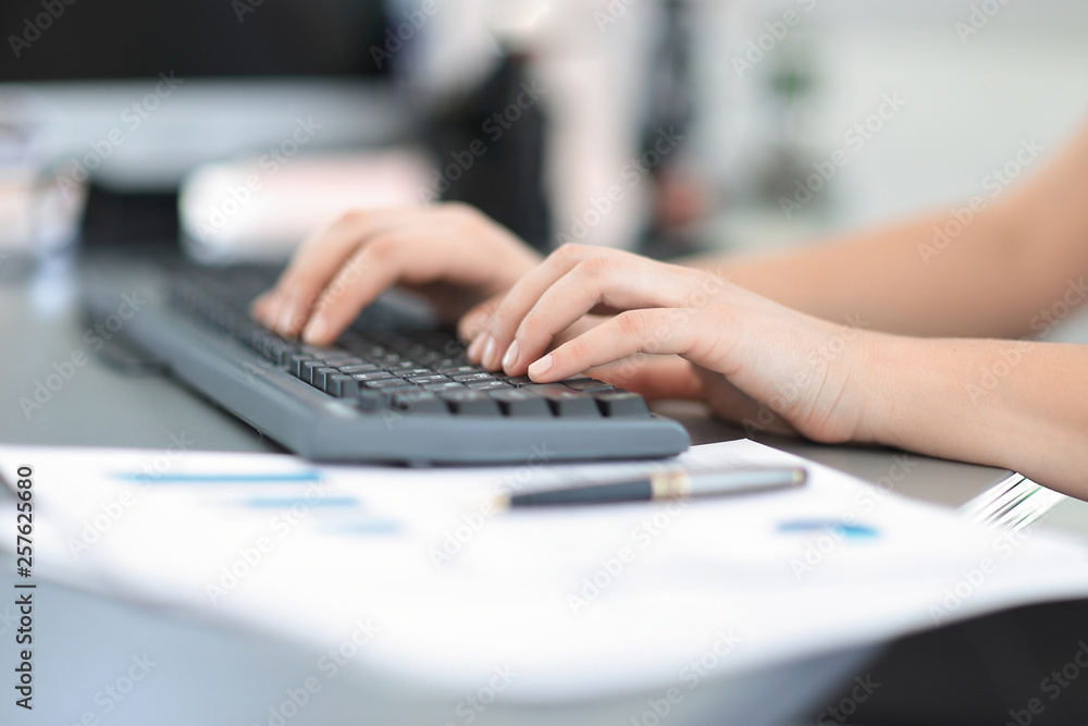 Closeup of a female hands busy typing on a laptop Closeup of a female hands busy typing on a laptop