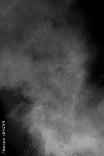 powder explosion with smoke on black background