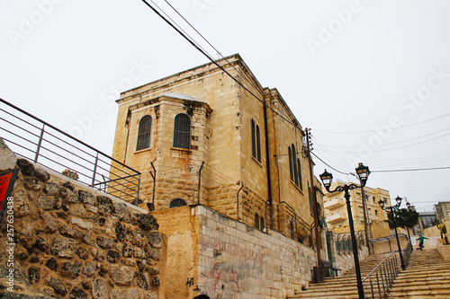 Jerusalem, Israel - 4/12/2015: St. Lazarus Church, the Tomb of Lazarus, located in the West Bank town of al-Eizariya, Bethany, near Jerusalem, Israel photo