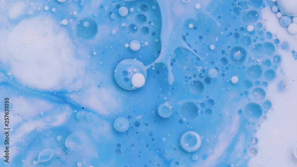 Bright colorful acrylic paint. Fantastic surface with Chaotic motion liquid. Top view. Macro structure of Multicolored Bubbles Paint and Oil. Bright colorful acrylic paint. Fantastic surface with Chaotic motion liquid. Top view. Macro structure of Multicolored Bubbles Paint and Oil.