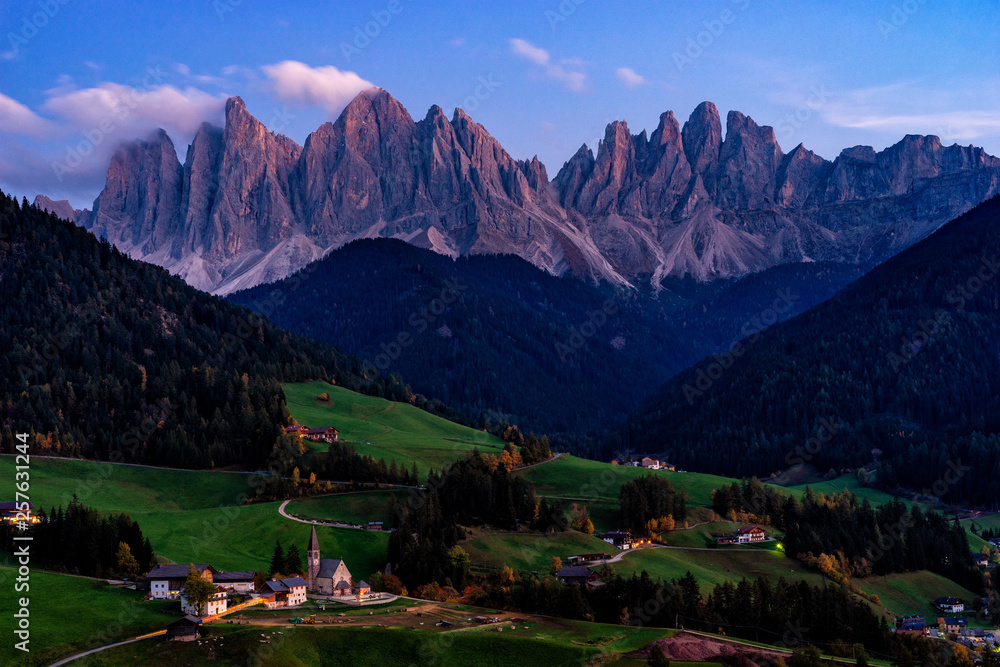 Santa Maddalena village with magical Dolomites mountains in background, Val di Funes valley, Trentino Alto Adige region, Italy, Europe. Night view of dramatic Italian Dolomites landscape.