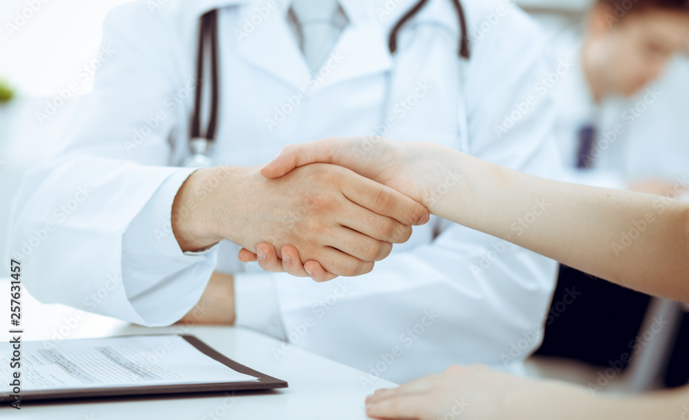 Partnership, trust og doctor and patient, medical ethics concept. Handshake in medicine Partnership, trust og doctor and patient, medical ethics concept. Handshake in medicine