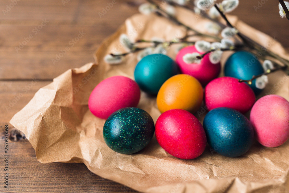 Easter background with Easter colorful eggs and spring flowers. Top view with copy space Easter background with Easter colorful eggs and spring flowers. Top view with copy space