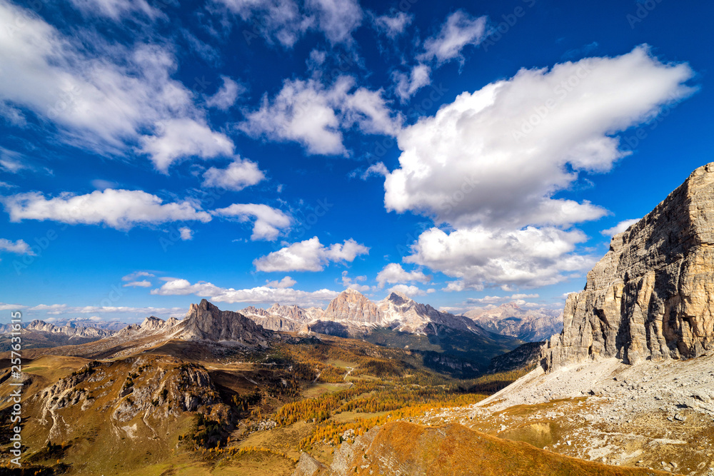 Colorful scenic view of majestic Dolomites mountains in Italian Alps. Landscape photo of colorful trees and rocky mountains in the the Italian Dolomites during autumn time.