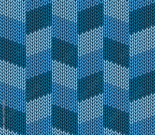 The Seamless blue knitted background.