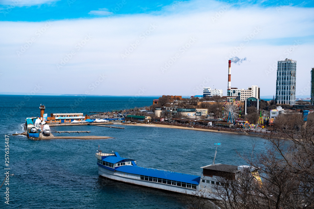 Vladivostok, Russia - 24 March, 2019: View of the city embankment and amusement park