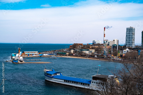 Vladivostok, Russia - 24 March, 2019: View of the city embankment and amusement park