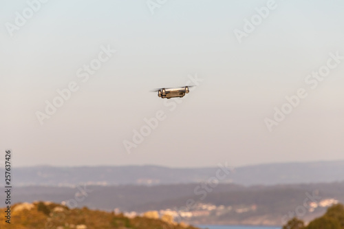 Flying drone taking pictures © Marcos Ferreiro