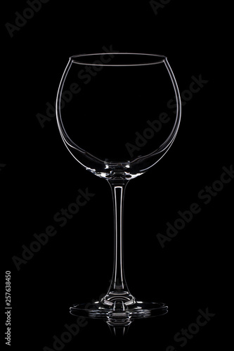 Wine glass on black.