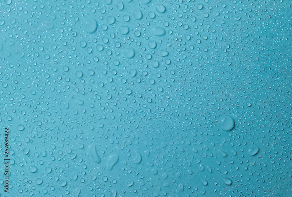 Drops of water on a blue glass texture background - obrazy, fototapety, plakaty 