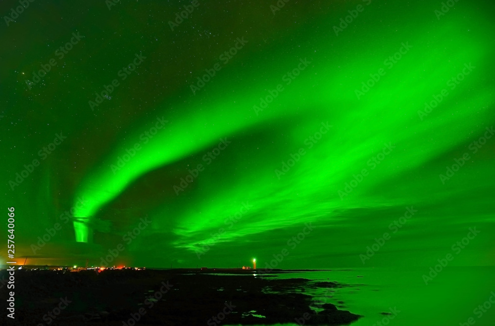 View of the northern light at Grotta Lighthouse in Reykjavik, Iceland.