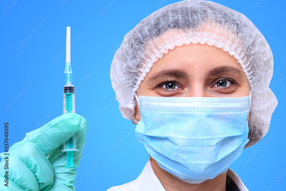 healthcare and medical concept - close-up of female doctor holding syringe with injection healthcare and medical concept - close-up of female doctor holding syringe with injection