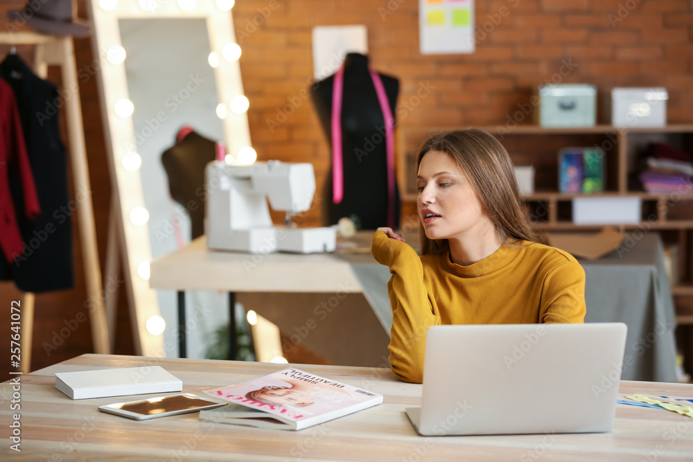 Beautiful female business owner working in atelier Beautiful female business owner working in atelier