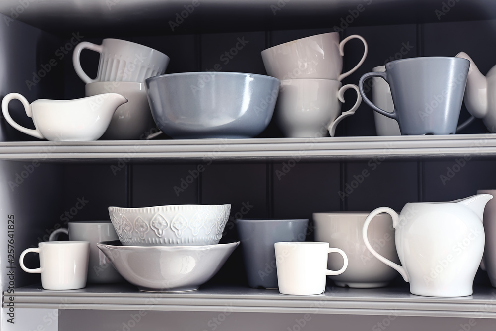 Shelves with clean dishes in kitchen Shelves with clean dishes in kitchen