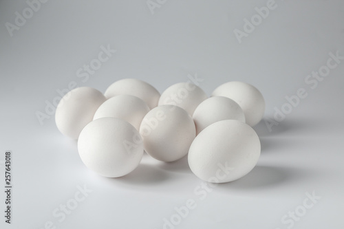 Tasty raw eggs on white background