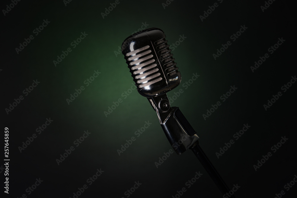 Fototapeta premium Retro microphone on dark color background