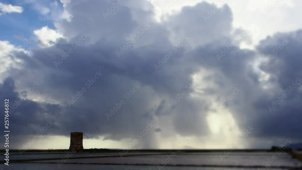 Rapidly changing weather over the Salt Flats of Trapani, Province of Trapani, Sicily, Italy Rapidly changing weather over the Salt Flats of Trapani, Province of Trapani, Sicily, Italy