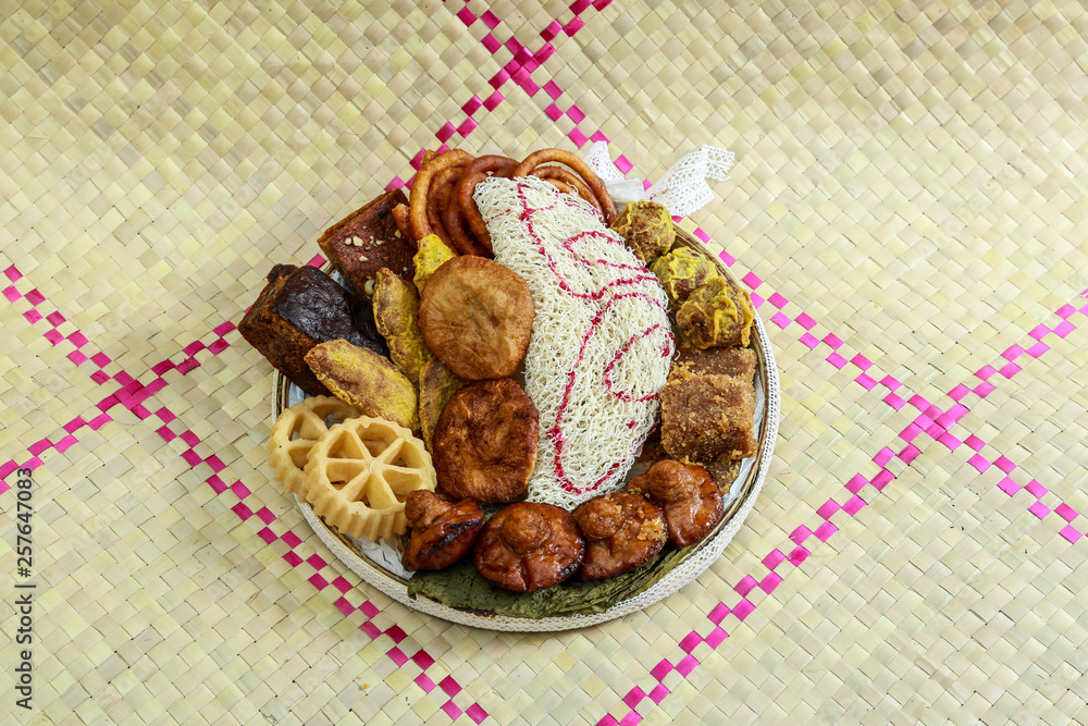 Kokis, Kewum, Aluwa and Aasmi. Sri Lankan Traditional Sweet Foods on Mat Kokis, Kewum, Aluwa and Aasmi. Sri Lankan Traditional Sweet Foods on Mat