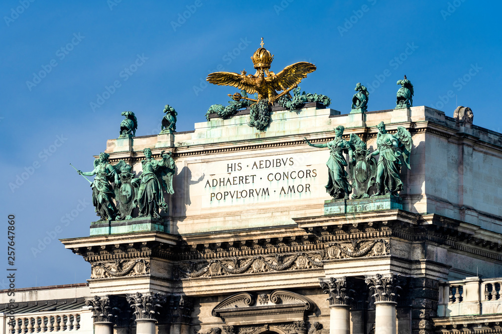 Austria, Vienna: Roof top above main entrance of famous New Castle (Neue Burg) in the city center of the Austrian capital with blue sky - concept culture travel architecture