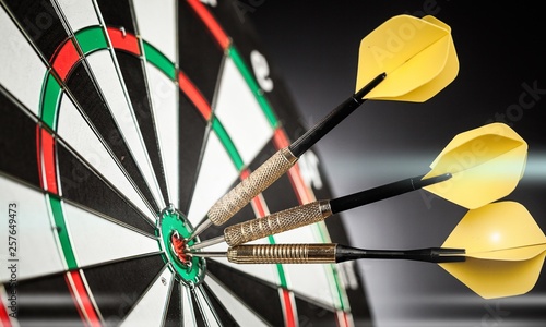 Dartboard with arrows on ackground