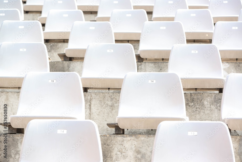 Obraz premium Empty white stadium stand rows with sunlight
