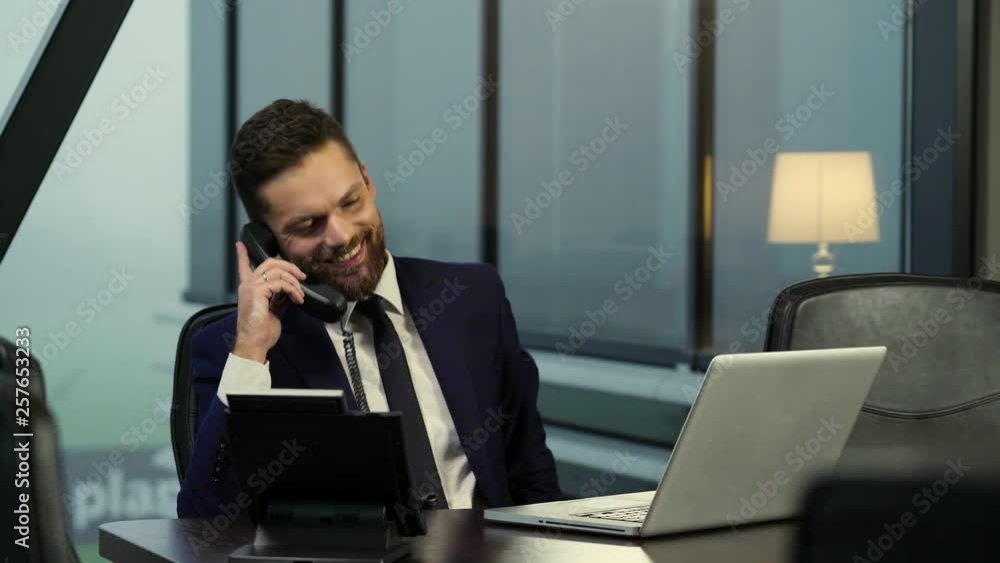 Young businessman talking on the phone. Young businessman talking on the phone.