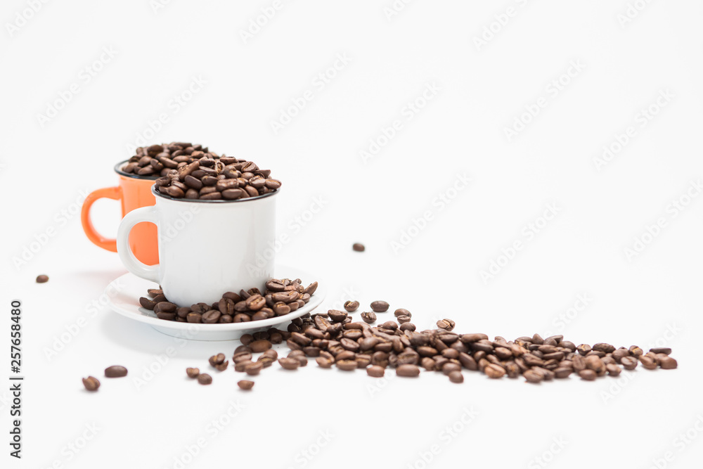 Coffee Cups Filled with Coffee Beans on a White Background Concept with Copy Space Coffee Cups Filled with Coffee Beans on a White Background Concept with Copy Space