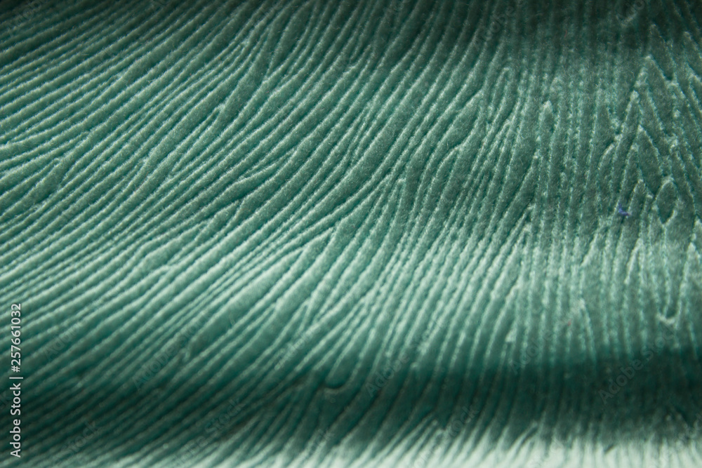 Texture of branched and wrinkled birch-colored fabric close-up top-down view