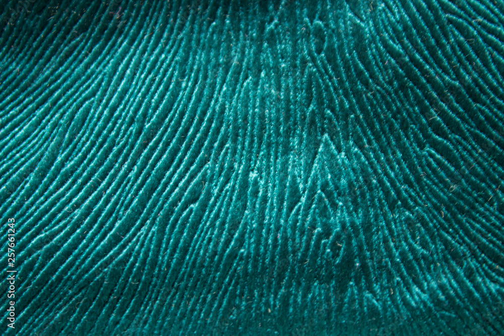 Obraz premium Texture fibrous and wrinkled fabric colors sea waves closeup view from the top down