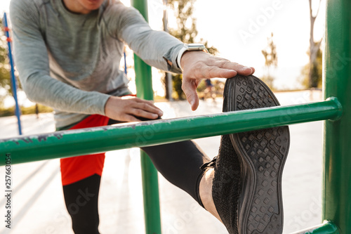 Confident young sportsman doing exercices
