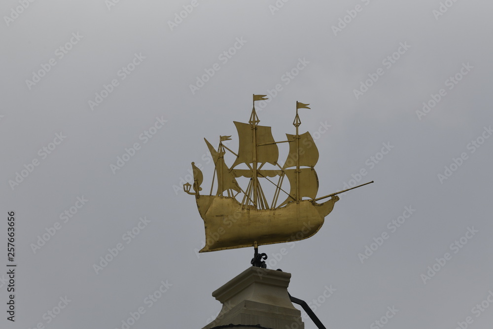 Gold ship on building in Ghent