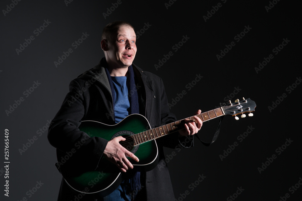 Young man with a guitar