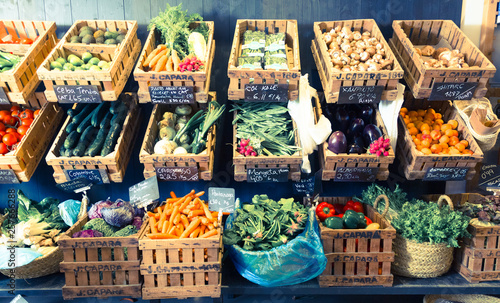 Fototapeta Naklejka Na Ścianę i Meble -  vegetables and fruits in wicker baskets in greengrocery