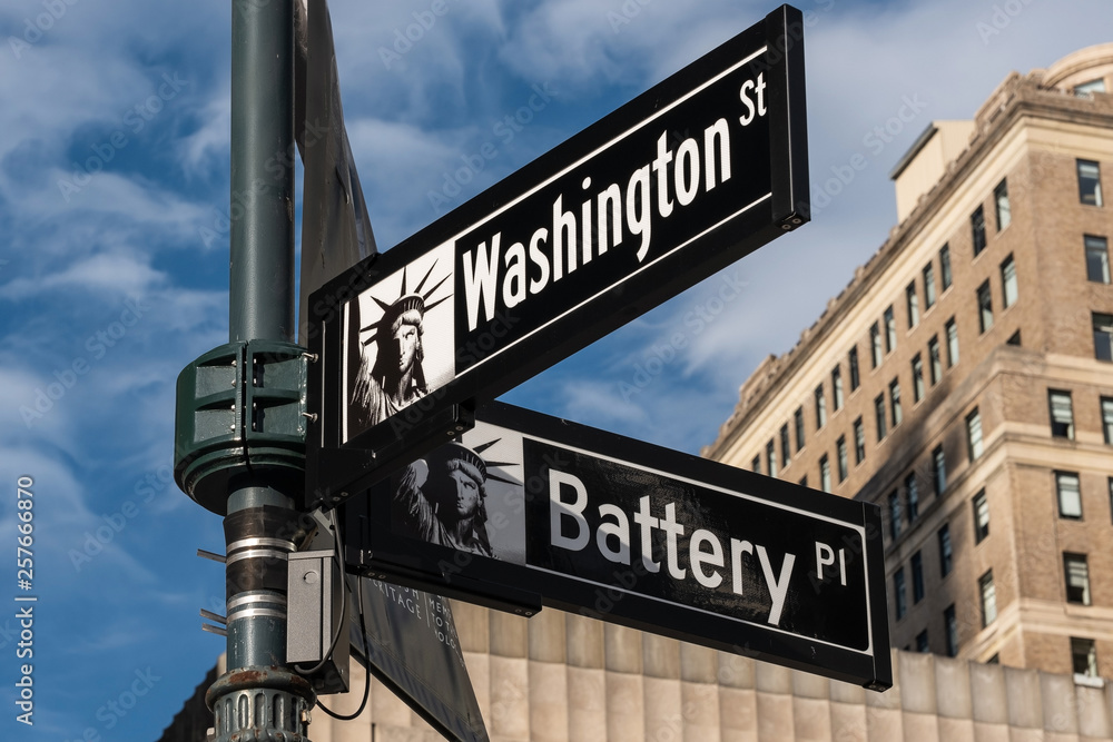 Close-up view of Signs of Battery Place and Washington Street and Maiden Lane in Financial District Lower Manhattan New York City