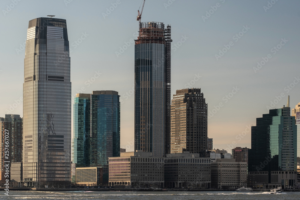 Modern skyscrapers in Jersey City by Hudson river view from Battery Park New York City