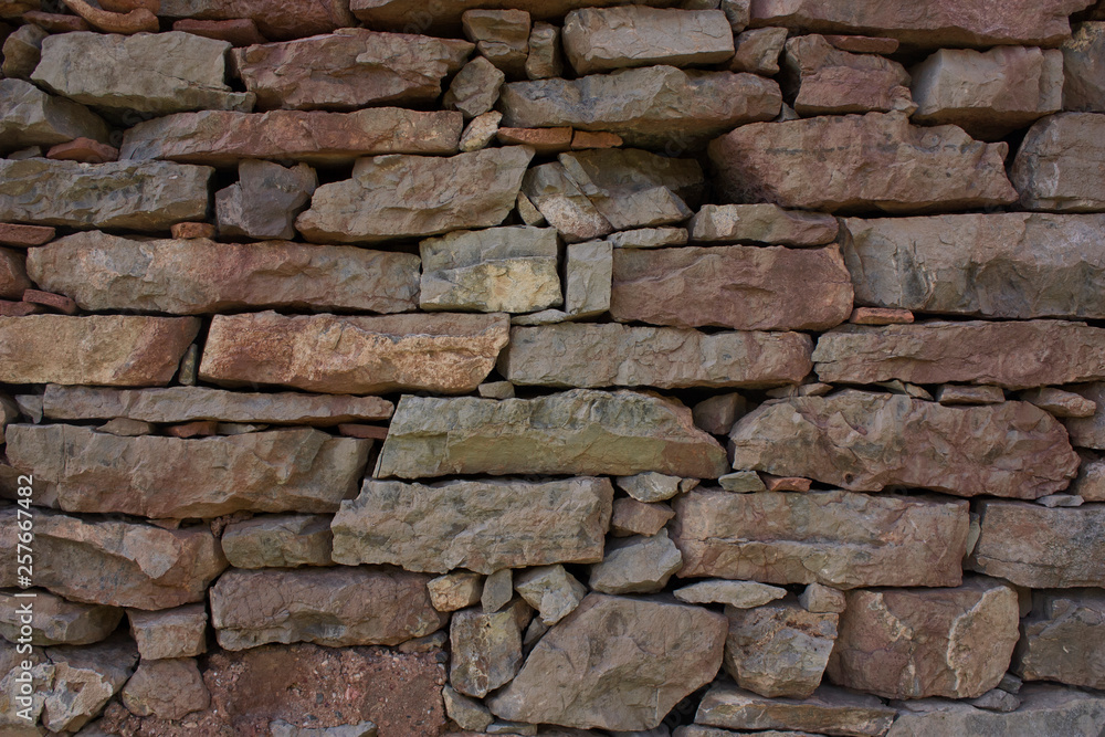 Old multicolored stone wall