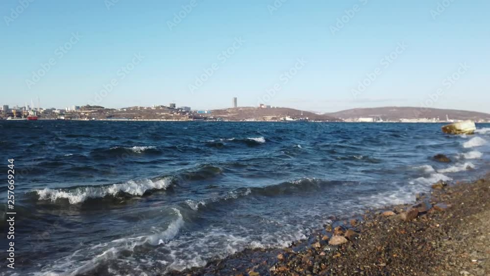 Seascape with city view on the horizon. Vladivostok, Primorsky Krai. Seascape with city view on the horizon. Vladivostok, Primorsky Krai.