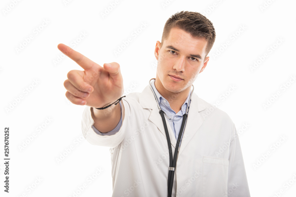 Portrait of young handsome doctor showing denial gesture Portrait of young handsome doctor showing denial gesture