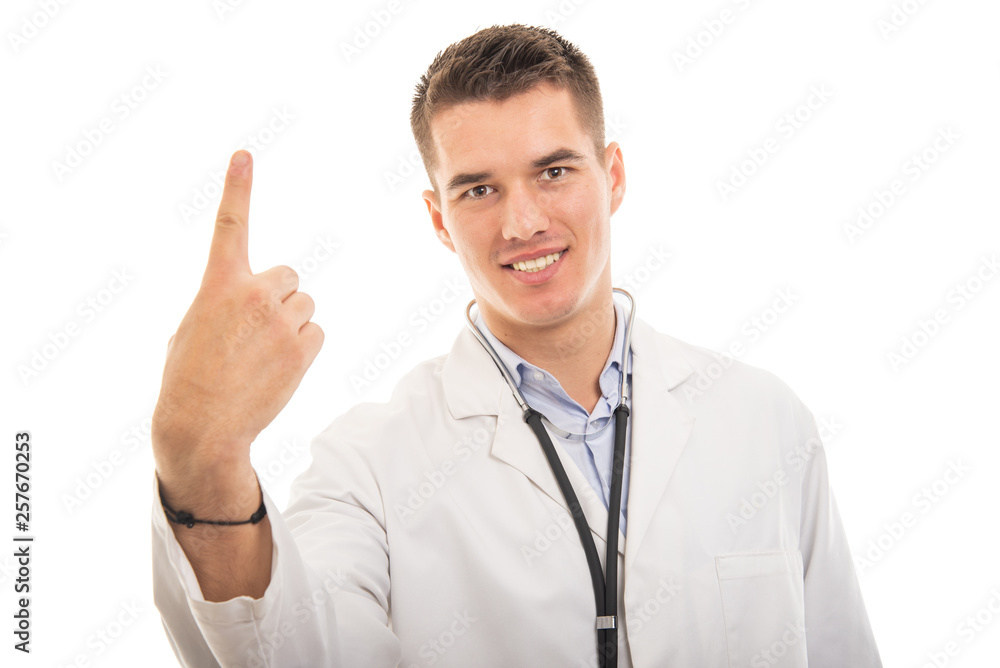 Portrait of young handsome doctor showing number one gesture
