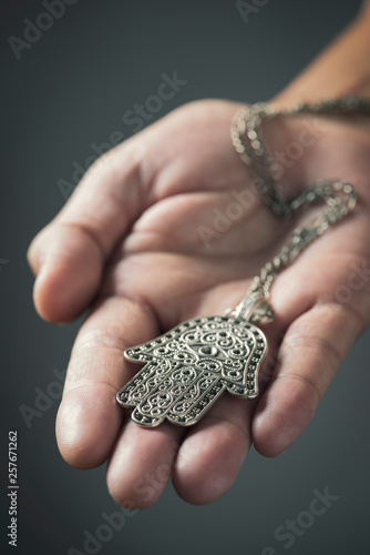 old hamsa amulet or hand of Fatima photo