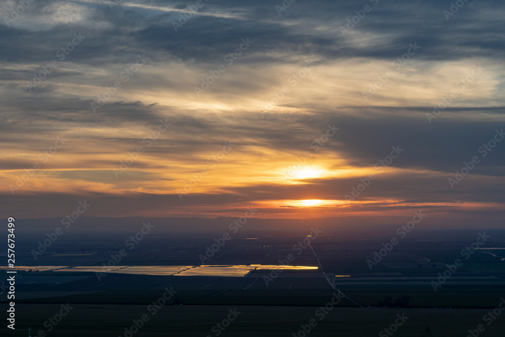 sunset over farm land