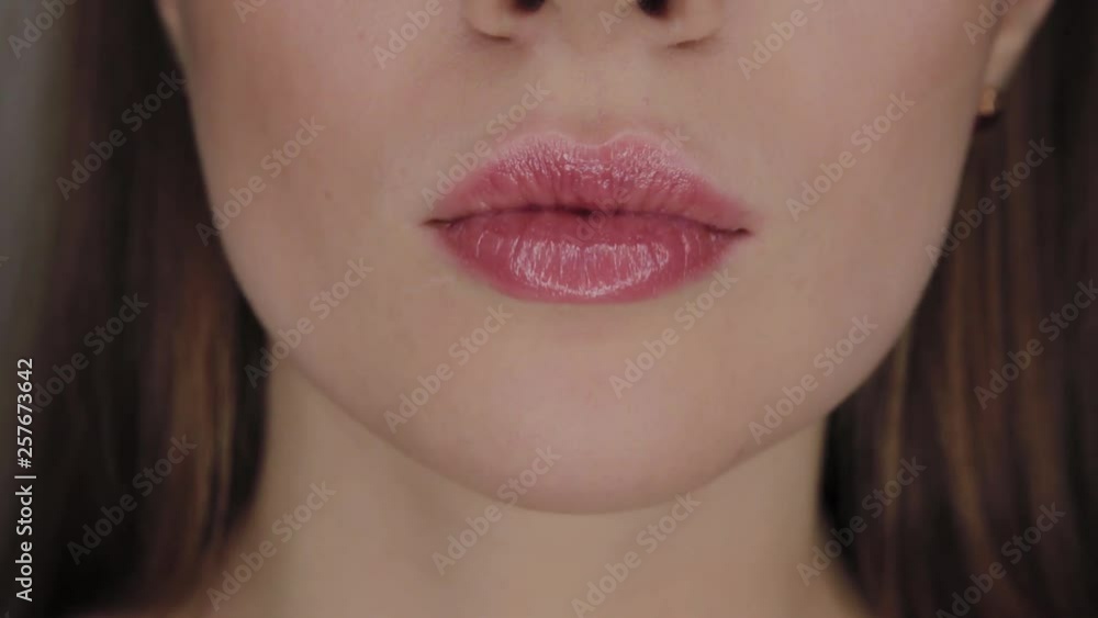 Portrait of a girl with a reflection of the annular LED light in the eyes.