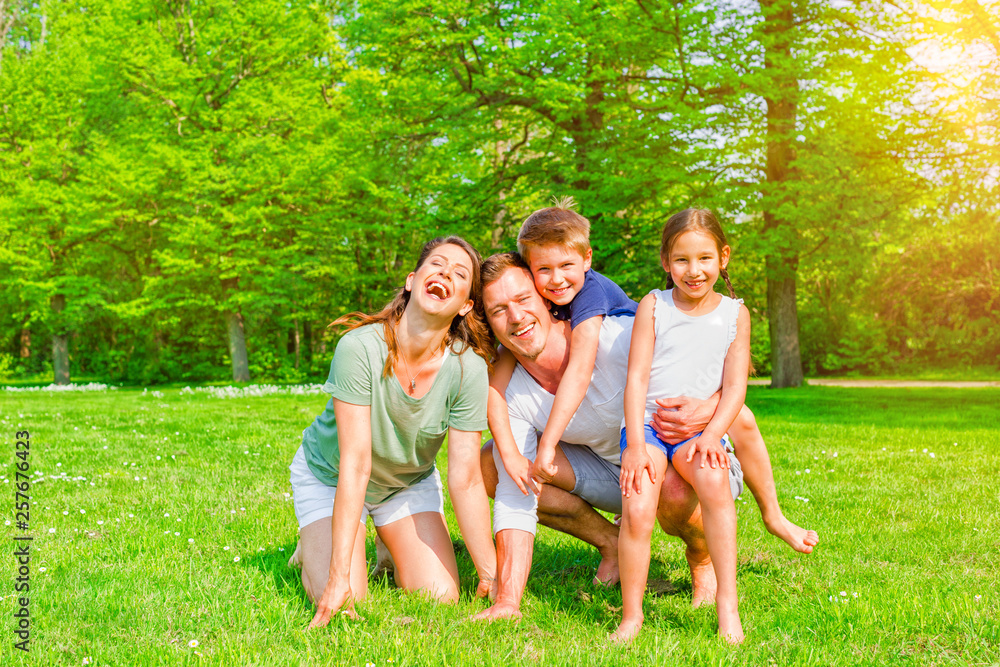 Obraz premium Happy Family in spring landscape 