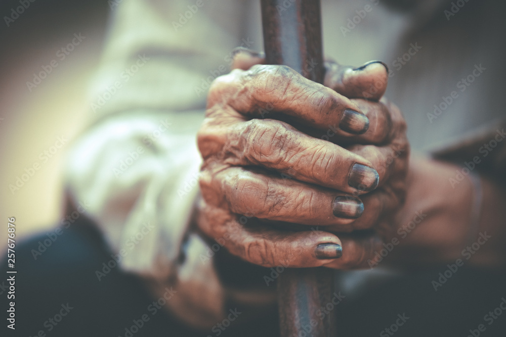 Dirty hands of farmers,close up dirty hands holding wood,Dirty hands from work,Old people with skin withered,