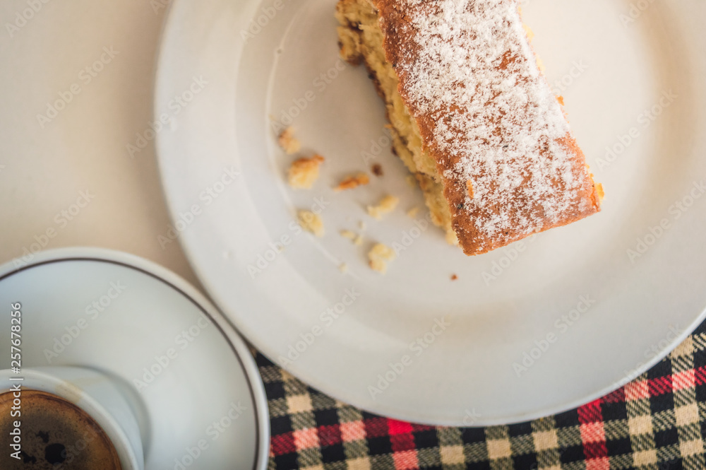 Flat lay of a slice of cake and a cup of coffee Flat lay of a slice of cake and a cup of coffee