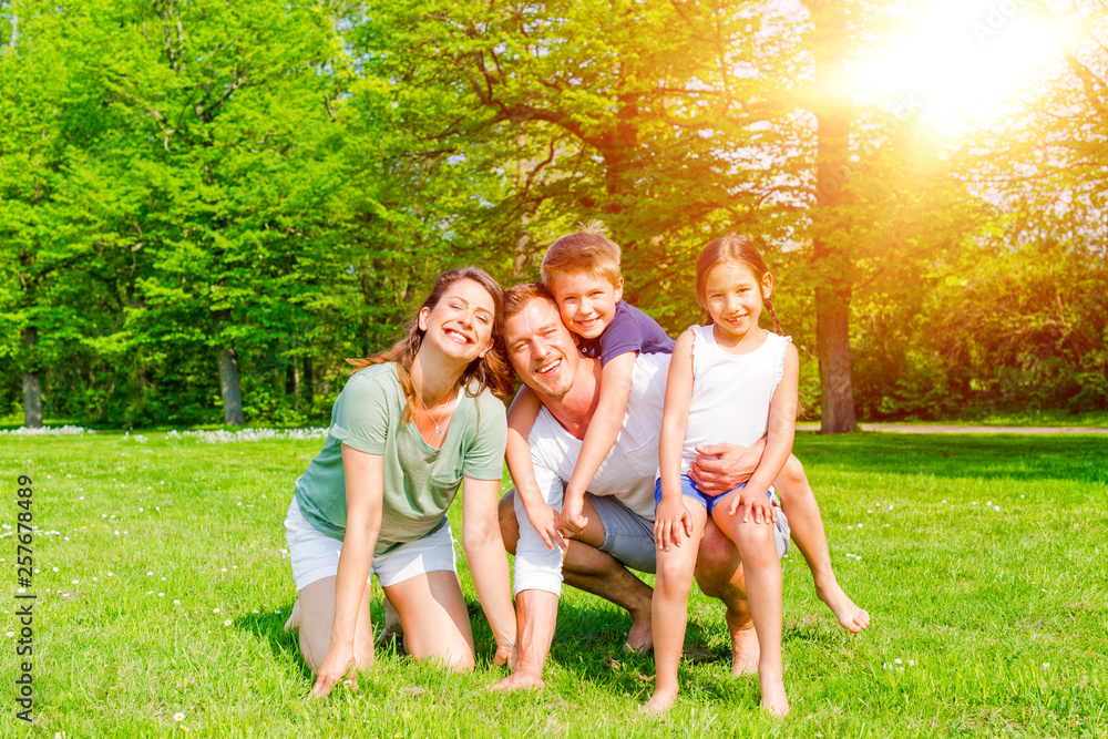 Fototapeta premium happy summer family dad with mom and children in spring