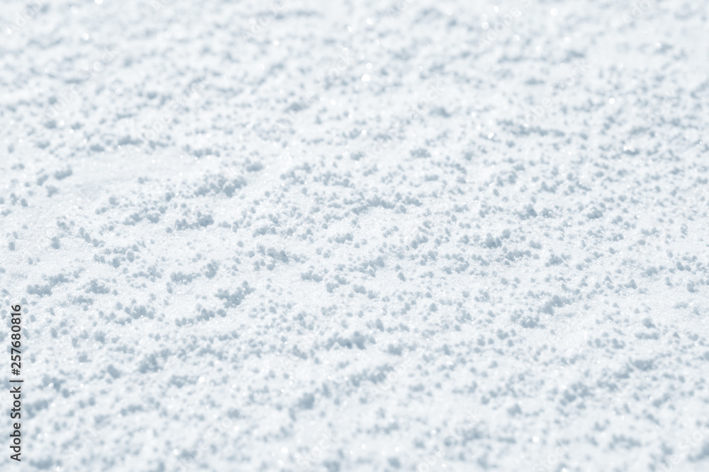 Obraz premium Fresh snow background texture. Winter background with snowflakes and snow mounds. Snow lumps.