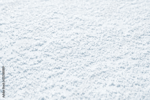 Fresh snow background texture. Winter background with snowflakes and snow mounds. Snow lumps.