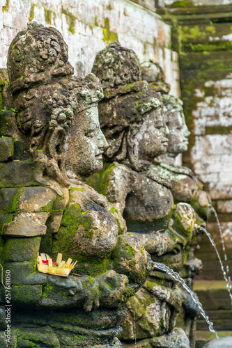 Bathing Temple traditional figures in Goa Gajah Temple (Elephant Cave) on Bali photo